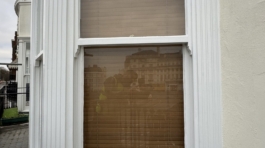 Restored sash window with detailed woodwork.