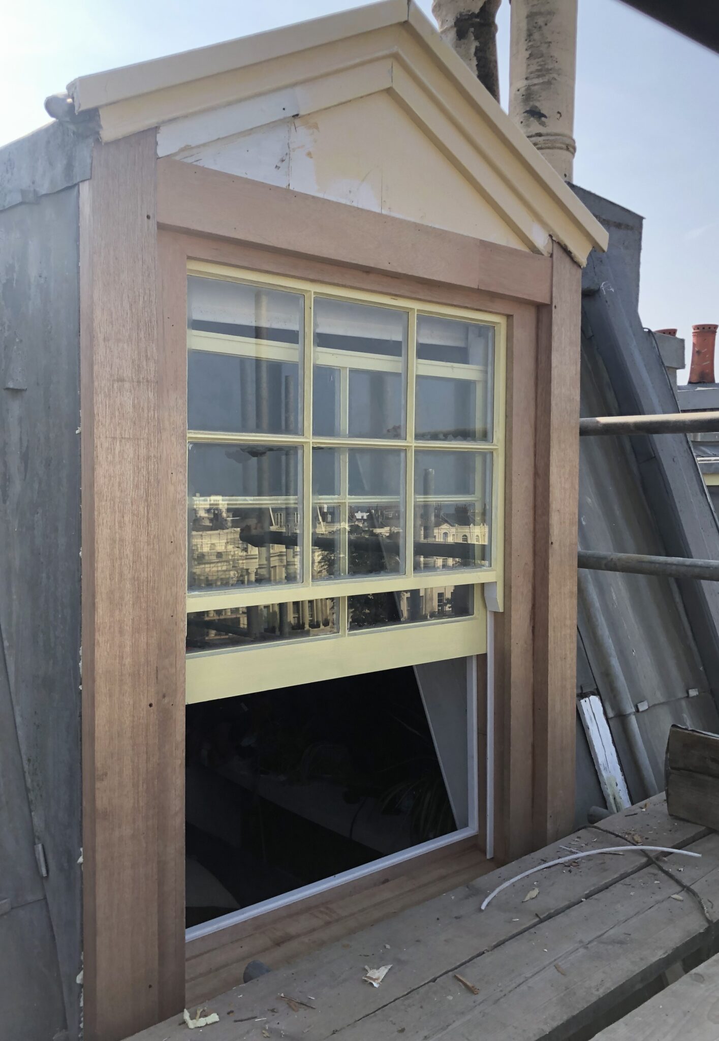 A photograph showcasing the restored dormer window, fully refurbished and installed to professional standards." That should give it a nice, professional touch!