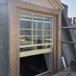 A photograph showcasing the restored dormer window, fully refurbished and installed to professional standards." That should give it a nice, professional touch!