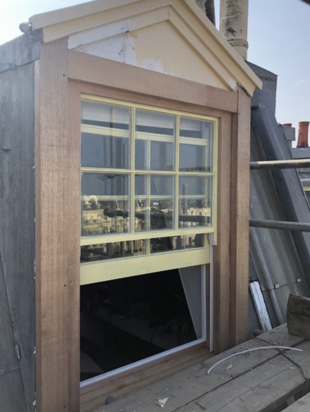 A photograph showcasing the restored dormer window, fully refurbished and installed to professional standards." That should give it a nice, professional touch!