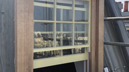 A photograph showcasing the restored dormer window, fully refurbished and installed to professional standards." That should give it a nice, professional touch!